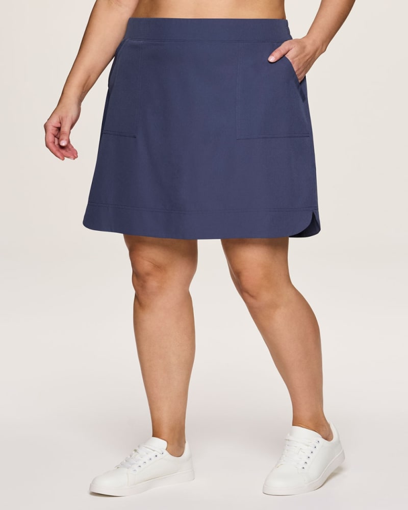 Front of a model wearing a size 3X Plus Prime Everything 20" Skort in Smoke Blue by RBX Active. | dia_product_style_image_id:352941